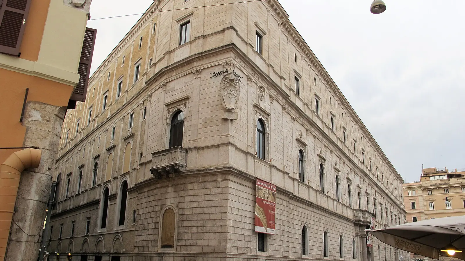 The long pale travertine Renaissance facade of the Palazzo della Cancelleria in Rome at 18:00 on a clear spring evening, palazzo della cancelleria