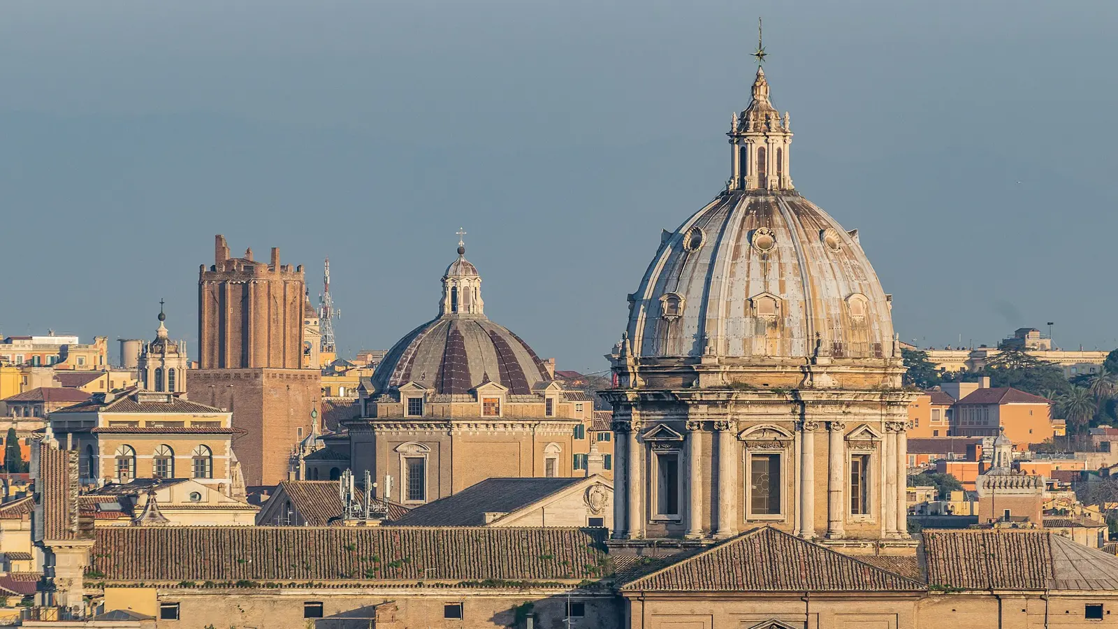 The baroque travertine facade and great dome of Sant'Andrea della Valle on Corso Vittorio Emanuele II in Rome at 09:00 on a clear morning, sant'andrea della valle
